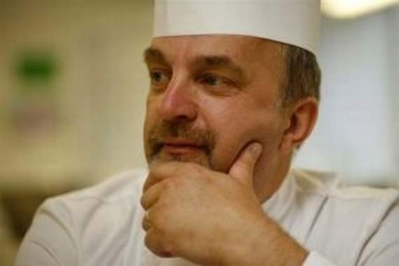 A chef in whites, thoughtful, in a professional kitchen — a portrait of the mentors who shaped a generation of Cornish hospitality.